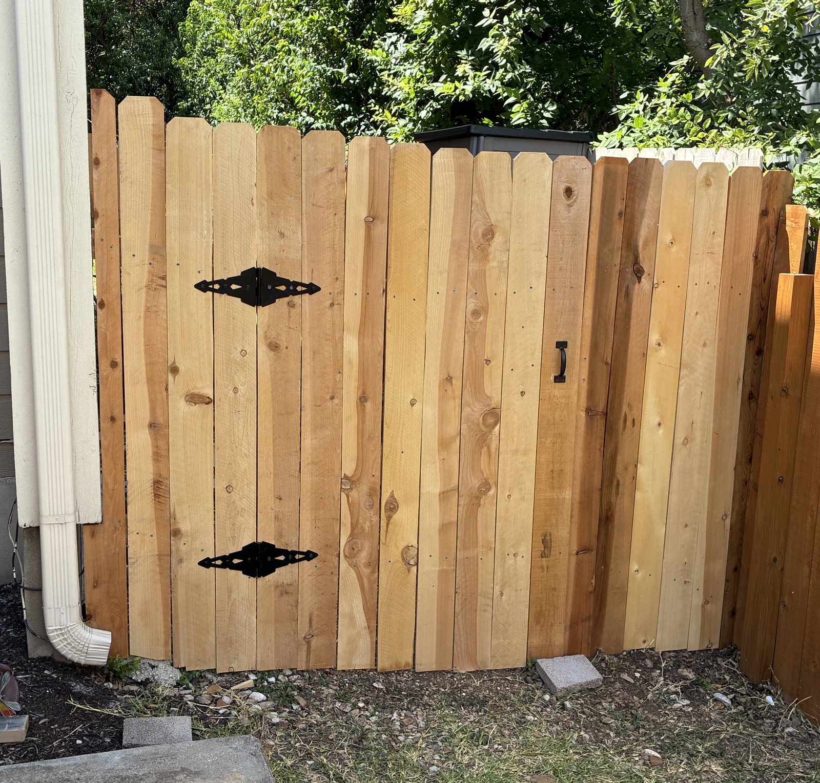 Custom cedar gate with decorative hinges Austin TX