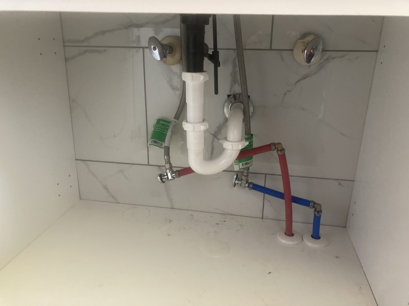 Bathroom drain and supply plumbing