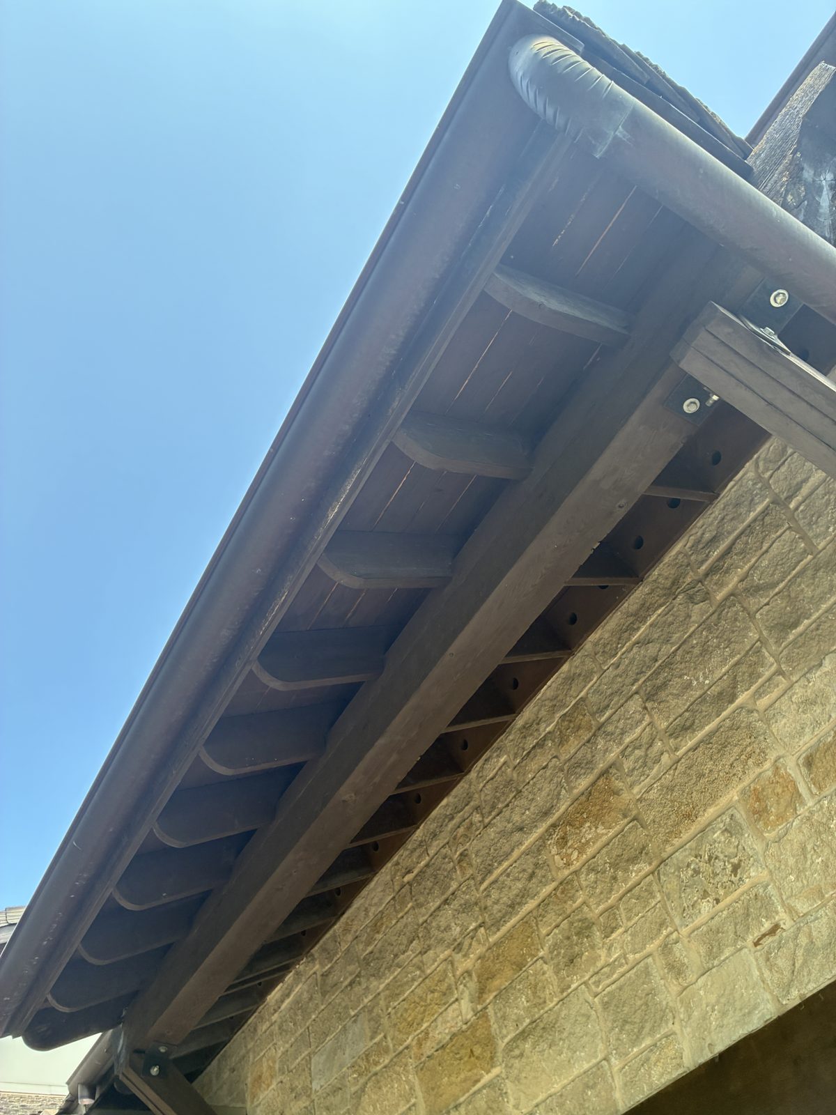 Weathered soffit before staining Austin TX